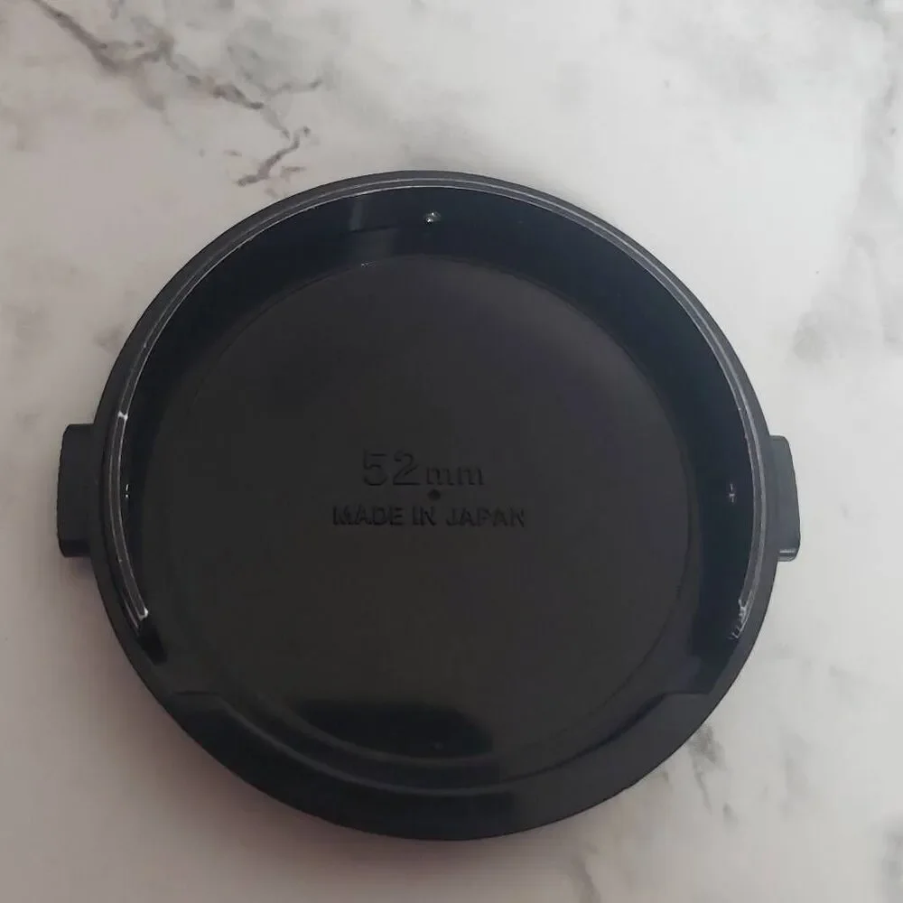 Nikon 52m.‎ Camera Cap
